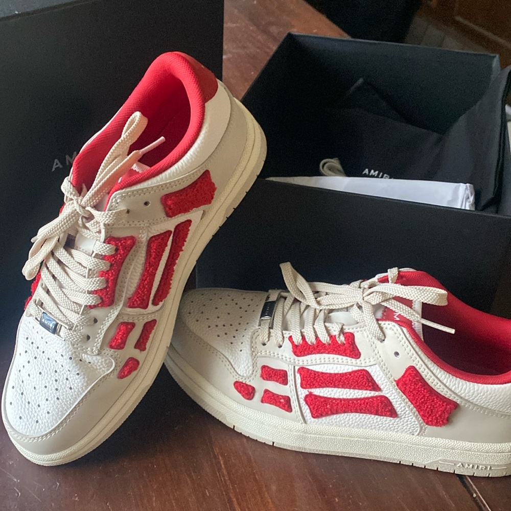 Lightly used Amiri Skeleton top low.